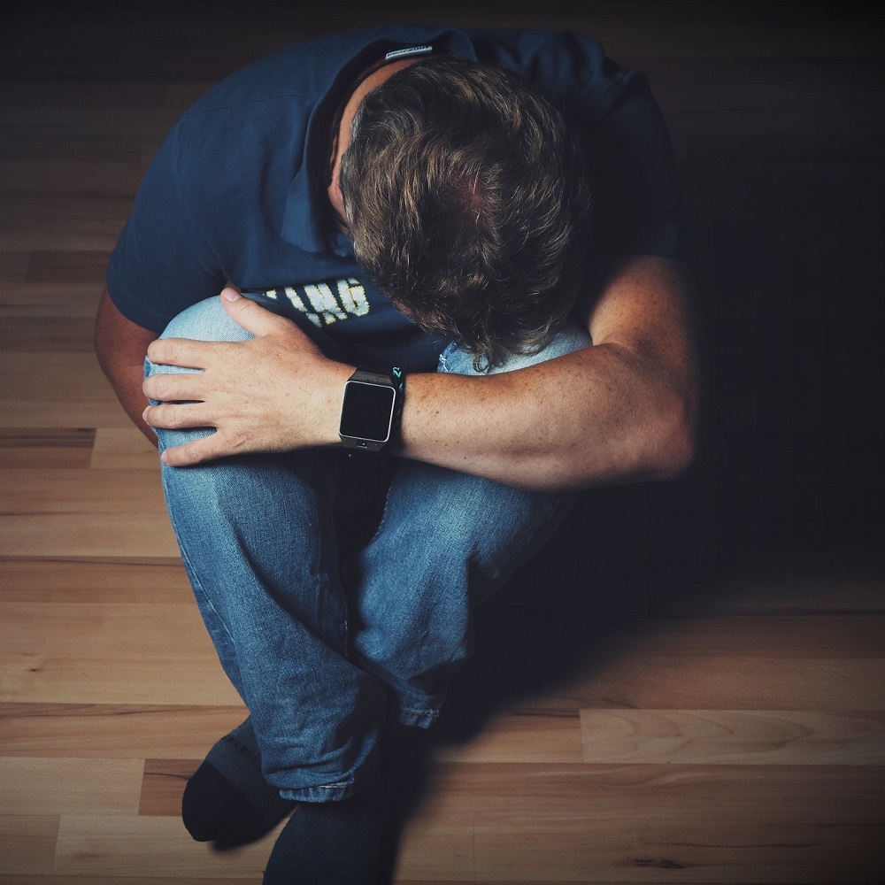 Man in pain - get relief from health conditions with hypnotherapy Rebecca Edmonds Hypnotherapy Hypnotherapist Online Hereford, Malvern and Droitwich